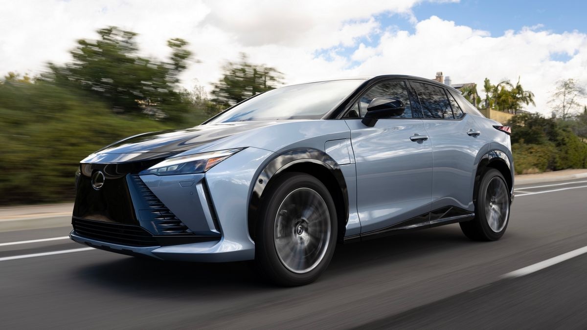 2024 Lexus RZ 450e driving on a road.
