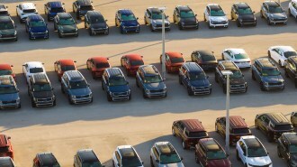 Birds eye view of a car dealership's lot.