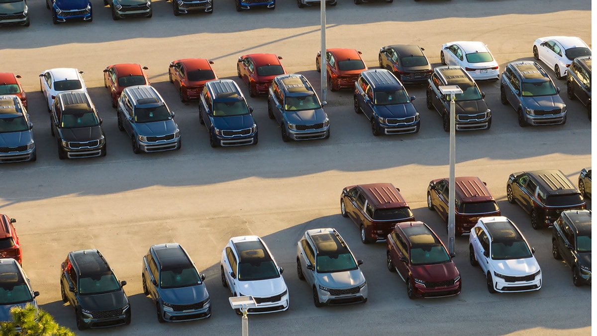 Birds eye view of a car dealership's lot.