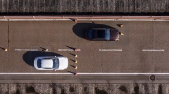 A brake performance test pitting real Mercedes brake pads (in the white car) against counterfeit pads (in the brown).