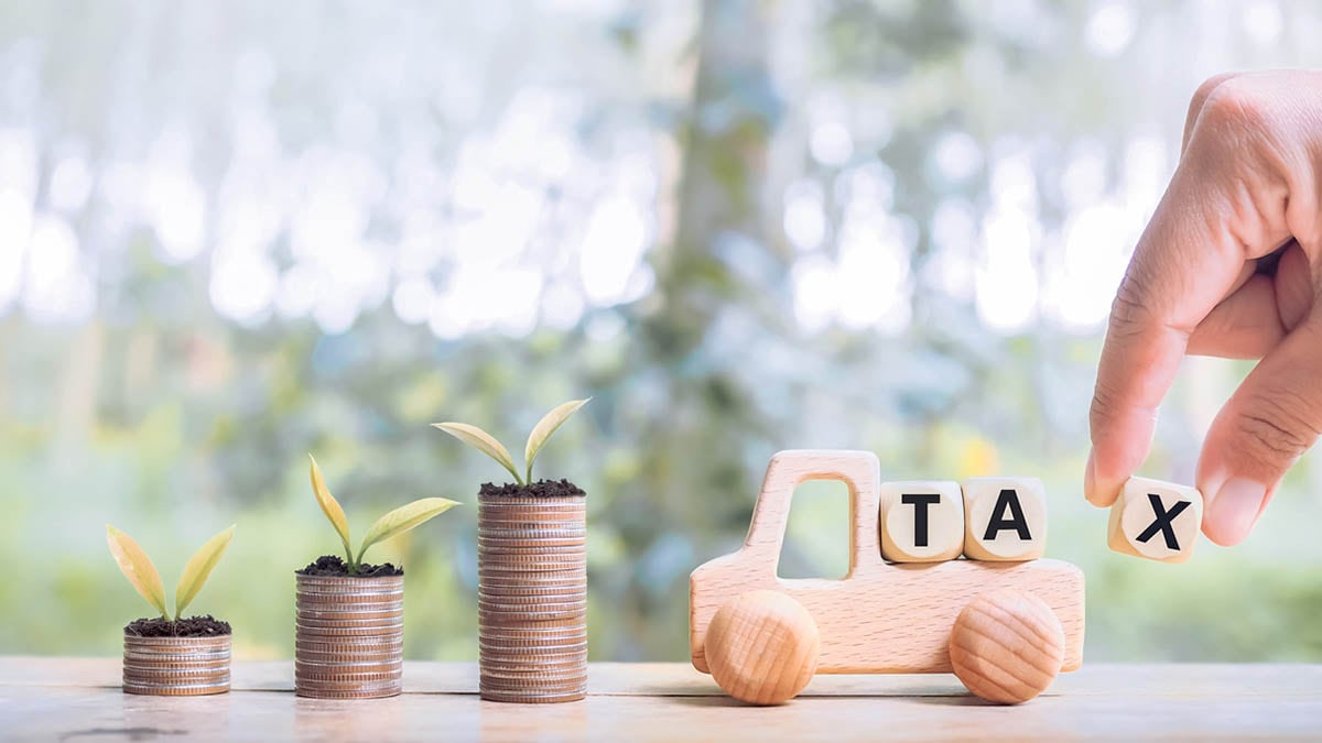 Toy truck with blocks spelling "tax"