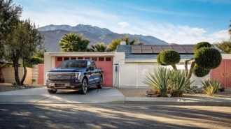 A 2025 Ford F-150 Lightning powering a home through a vehicle-to-grid power setup