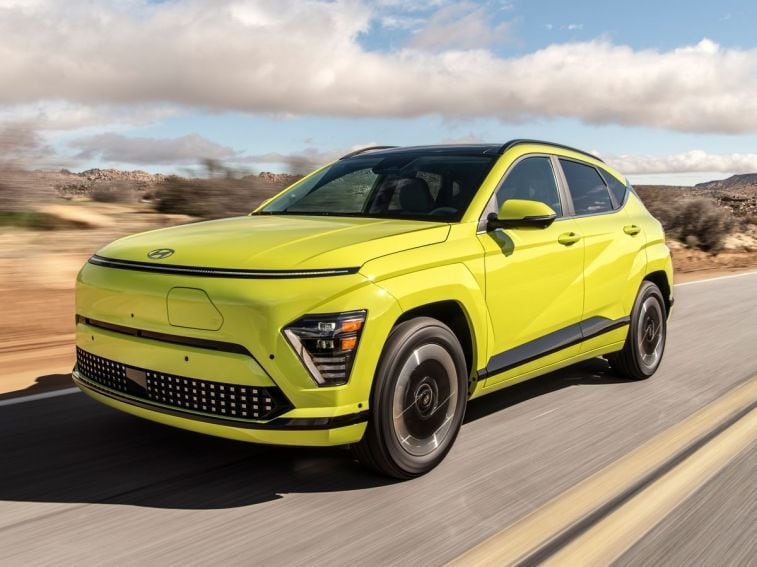 2025 Hyundai Kona Electric driving on a road.