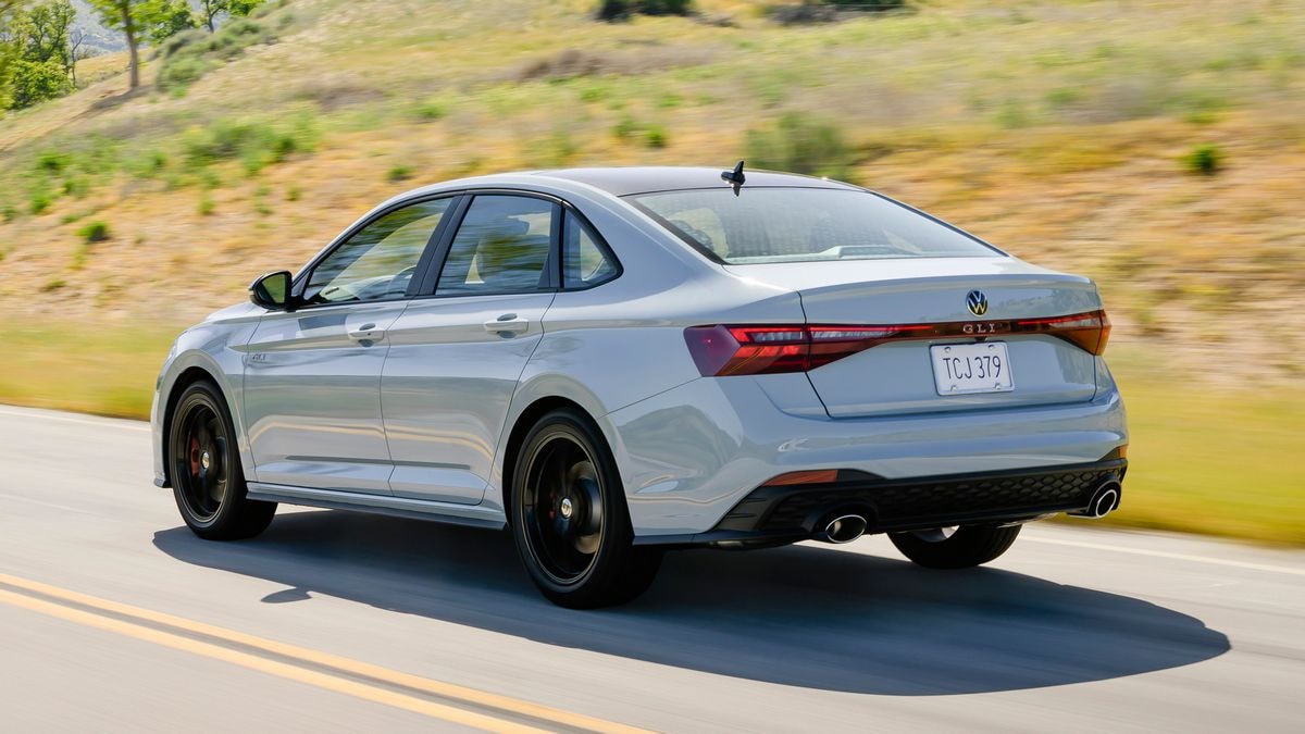 2025-volkswagen-jetta-gli-driving-rear-3qtr