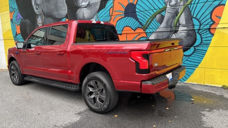 The 2024 Ford F-150 Lightning seen from a rear quarter angle
