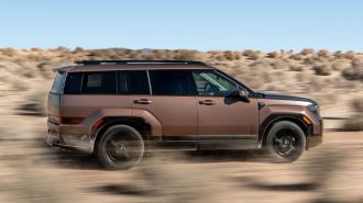 2024 Hyundai Santa Fe Calligraphy driving through the desert.
