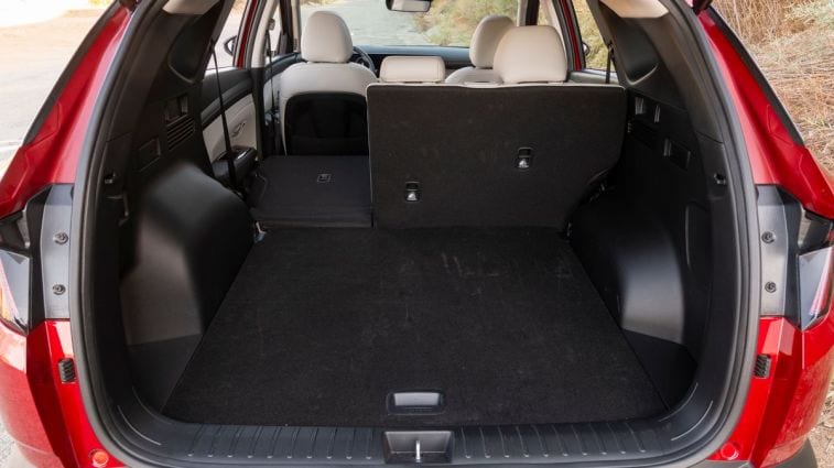 2025 Hyundai Tucson Limited rear cargo area with seat folded.