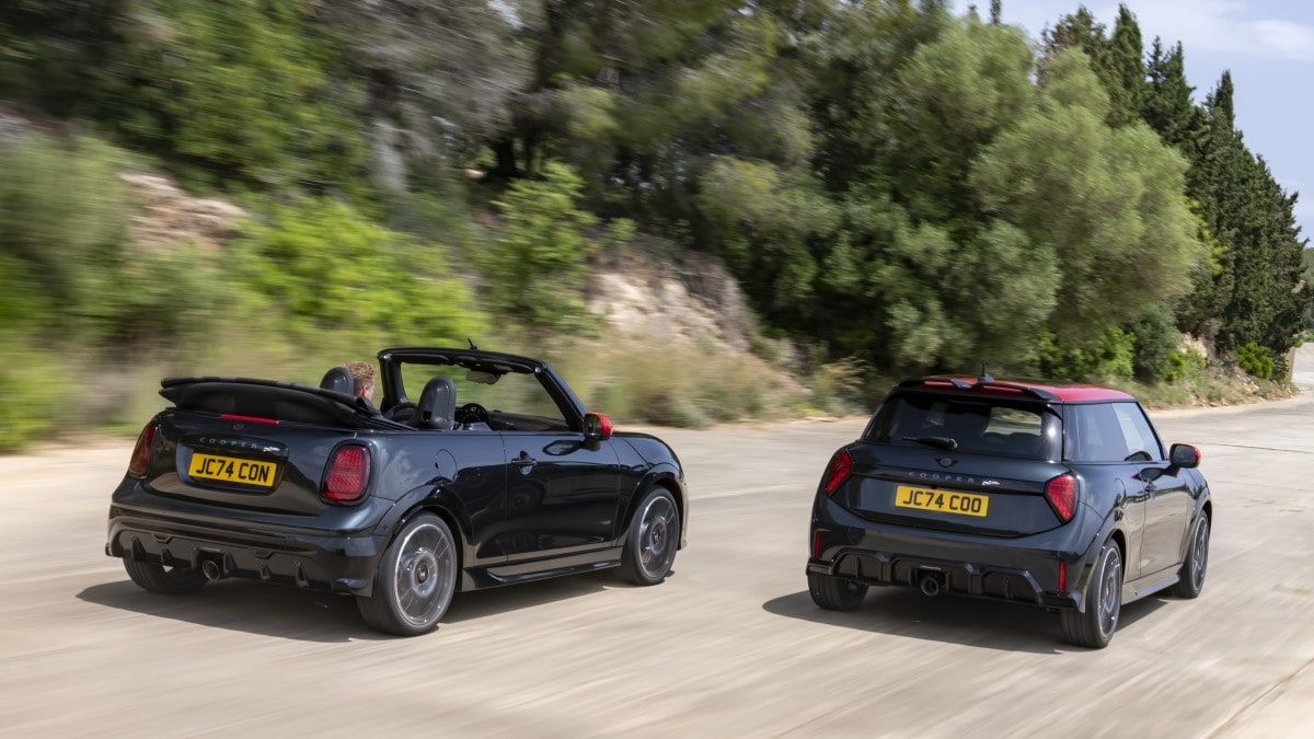 The 2025 Mini John Cooper Works hardtop and convertible models side by side, seen from a rear quarter angle