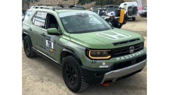 The updated 2026 Honda Passport seen from a front quarter angle as entered in the 2025 Rebelle Rally