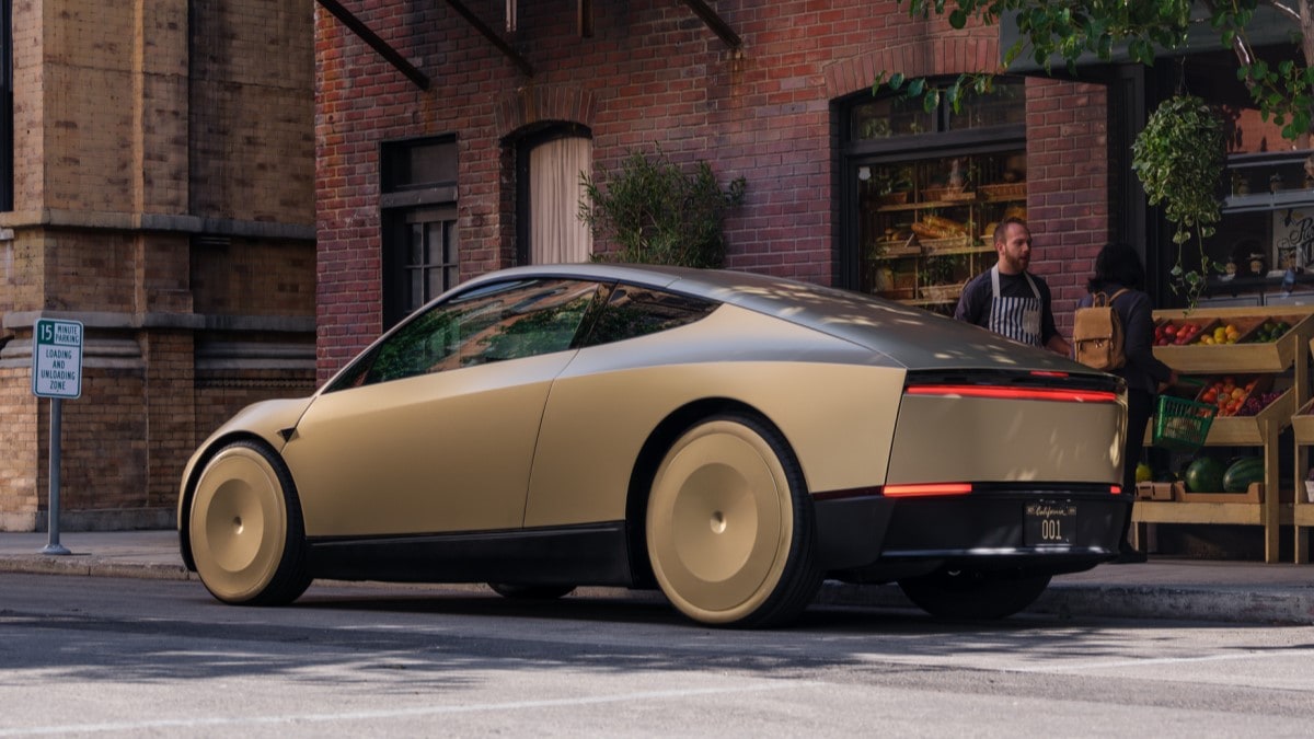 The Tesla Robotaxi seen from a rear quarter angle