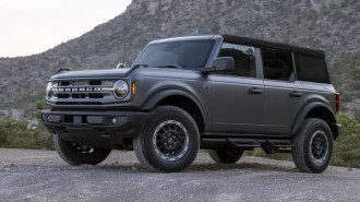 The 2025 Ford Bronco in matte paint film seen from a front quarter angle