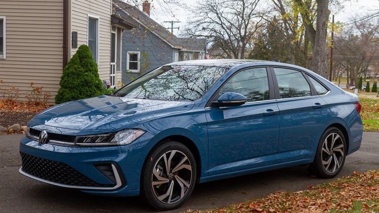 2025 Volkswagen Jetta parked in front of a house.
