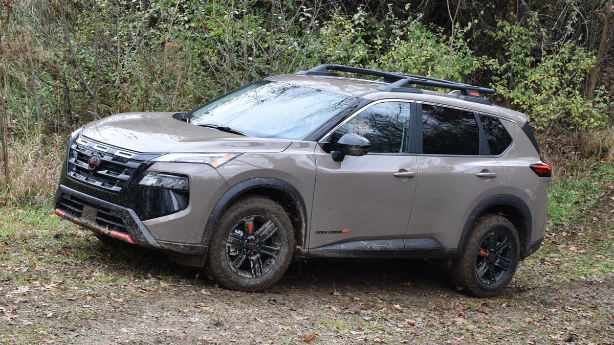 2025 Nissan Rogue Rock Creek Edition on a dirt path.
