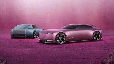 A pair of Jaguar Type 00 Concepts seen from the front and rear quarter angles