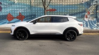 The 2025 Chevrolet Equinox EV seen in profile