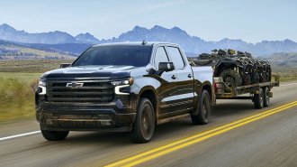 2025 Chevrolet Silverado 1500 towing a trailer.