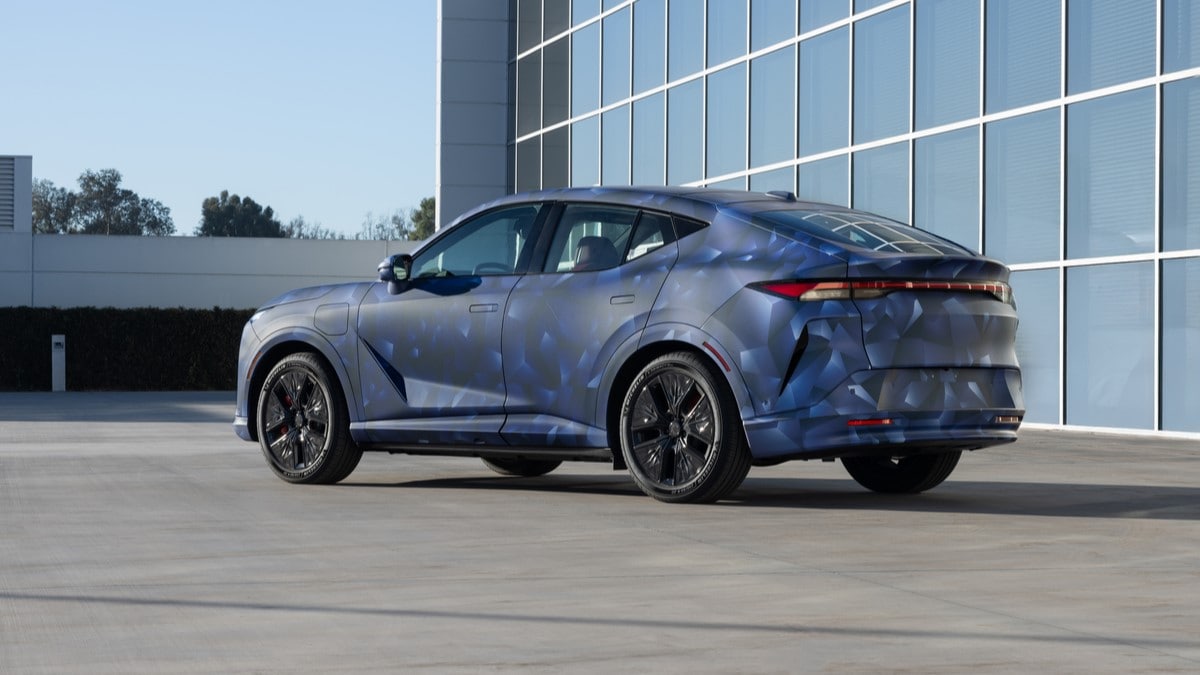 The Acura RSX prototype, in camouflage, seen from a rear quarter angle