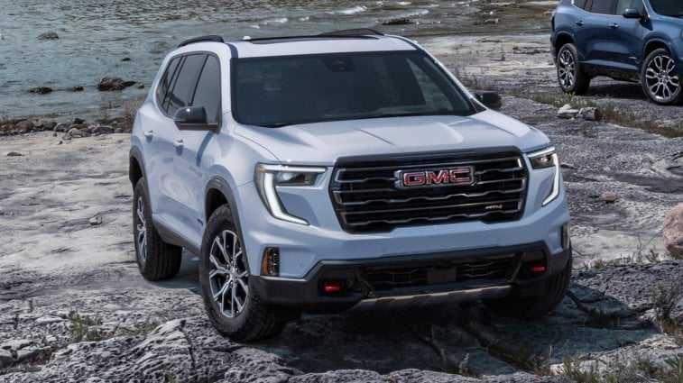 2025 GMC Acadia on a rocky beach.