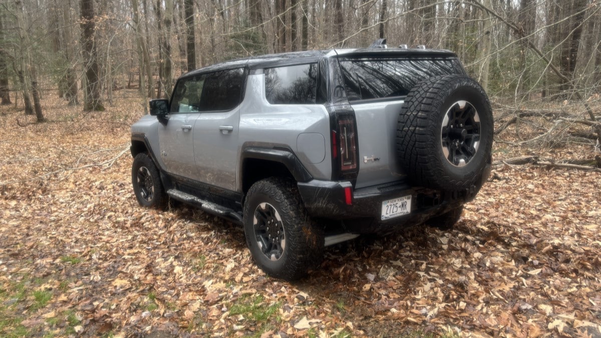 The 2025 GMC Hummer SUV seen from a rear quarter angle