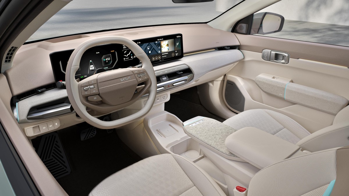 The interior of the 2026 Kia EV4 with its slide-out table extended