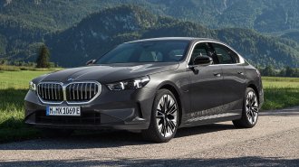 2025 BMW 5 Series 550e in gray.