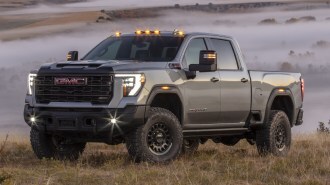 2025 GMC Sierra 2500HD AT4X parked in a field.