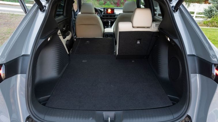 2025 Acura ADX A-Spec rear cargo area with one seat folded.