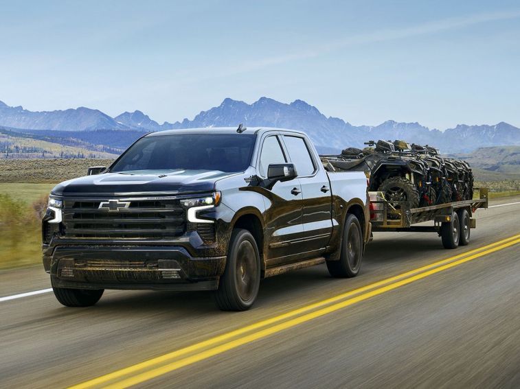 2025 Chevrolet Silverado 1500 towing a trailer.