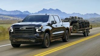 2025 Chevrolet Silverado 1500 towing a trailer.