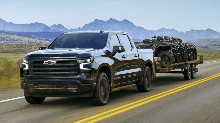 2025 Chevrolet Silverado 1500 towing a trailer.