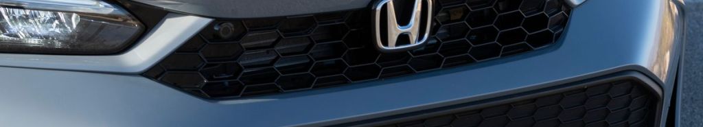 https://www.kbb.com/wp-content/uploads/2025/04/2025-honda-civic-hybrid-grille-badge.jpg?w=1024