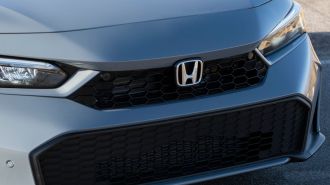 2025 Honda Civic Hybrid grille badge.