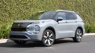 2025 Mitsubishi Outlander SEL in Moonstone Gray Metallic with black roof.