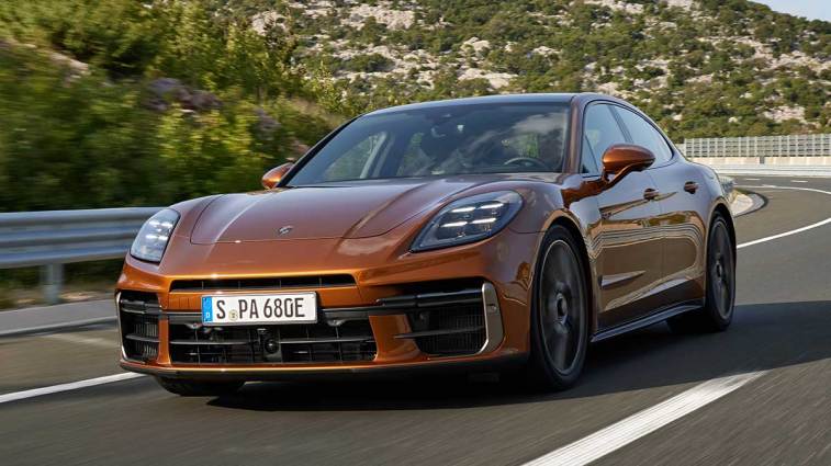 2025 Porsche Panamera driving on a road.