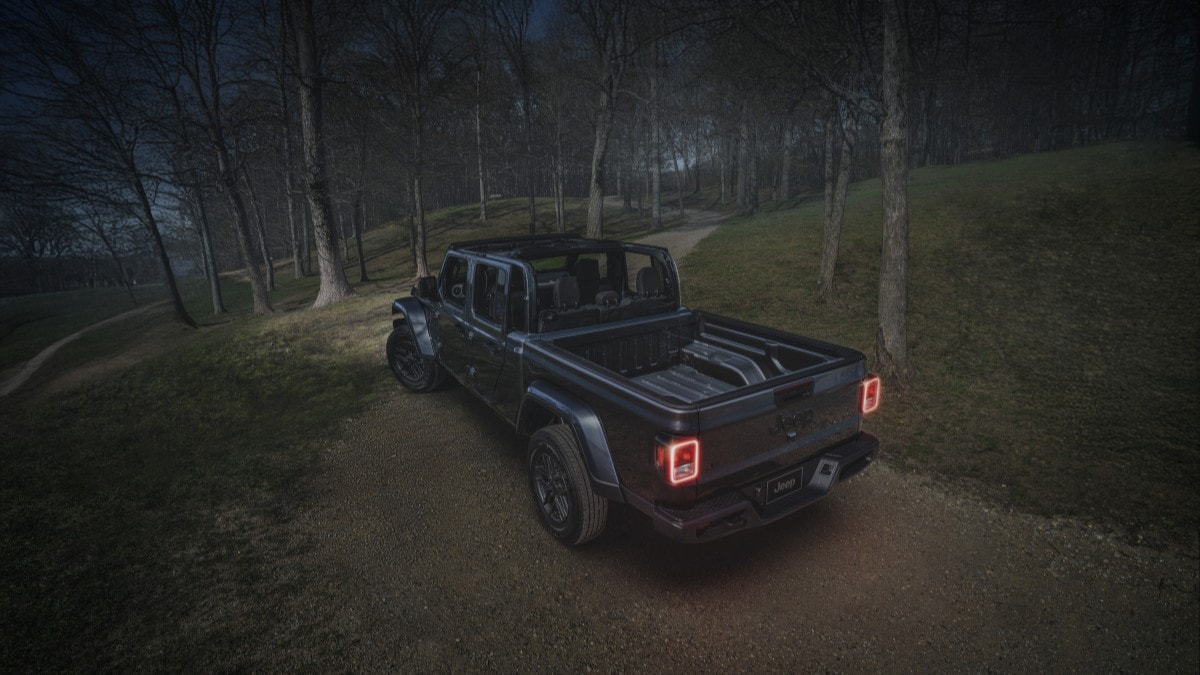 The 2025 Jeep Gladiator Dark Sky seen from a rear quarter angle