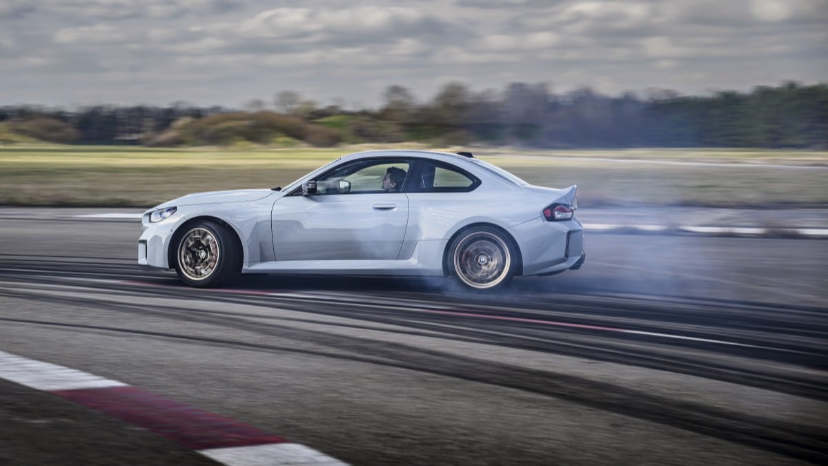 The 2026 BMW M2 CS seen in profile, drifting