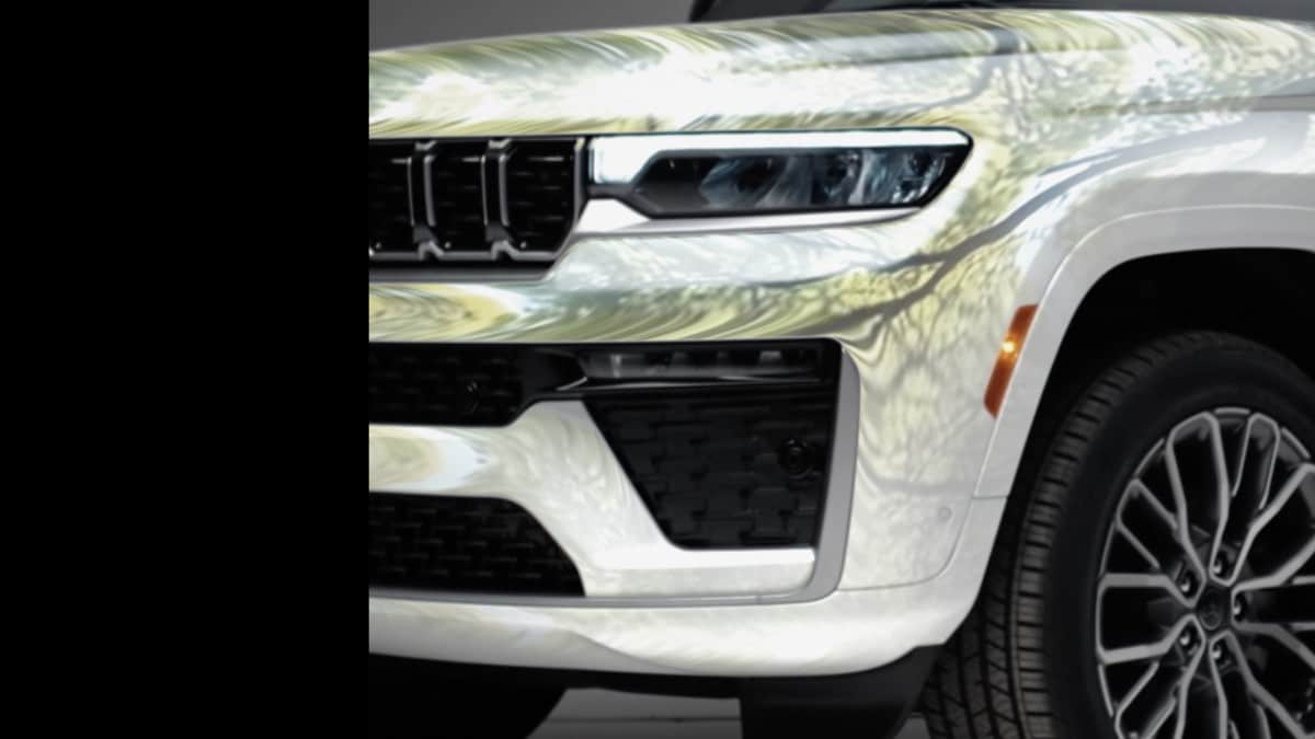 A teaser photo showing the front end of the 2026 Jeep Grand Cherokee