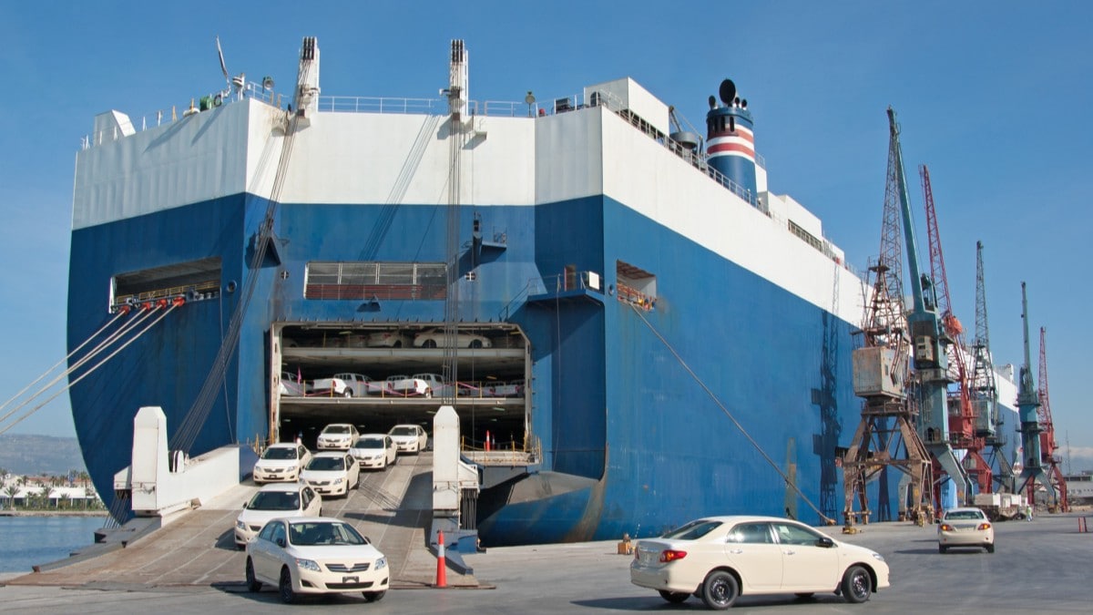 cars exiting a roll-on/roll-off container ship