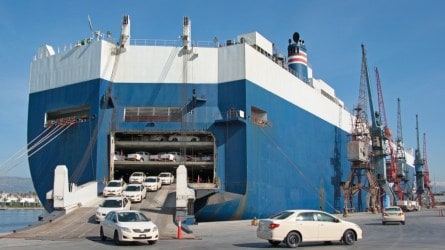 cars exiting a roll-on/roll-off container ship