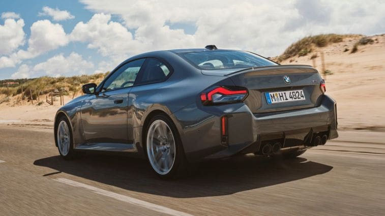2025-bmw-m2-driving-rear-3qtr
