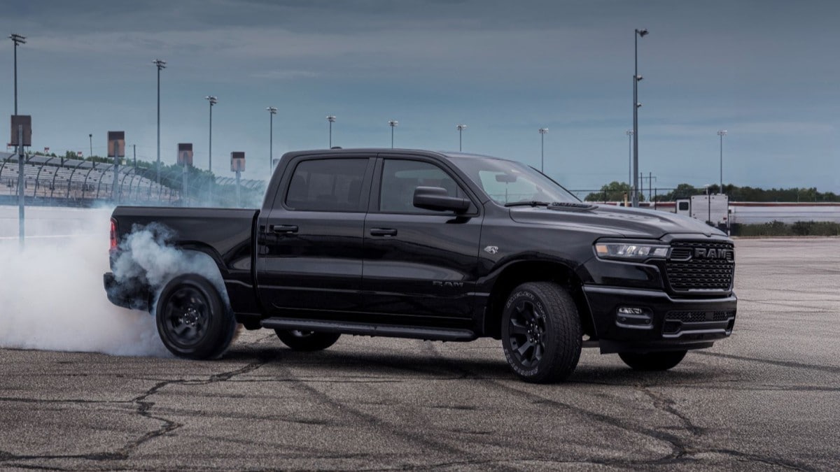 The 2026 Ram 1500 with the optional Hemi V8 seen in profile with smoking tires